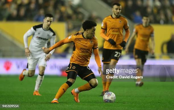 Helder Costa of Wolverhampton Wanderers runs with the ball during the Sky Bet Championship match between Wolverhampton Wanderers and Derby County at...