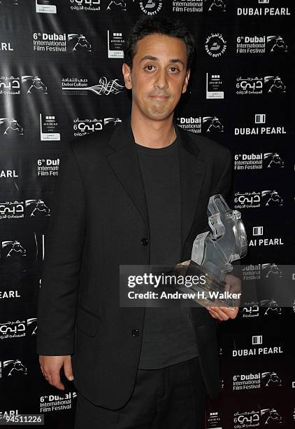 Director Nassin Amouach with the Muhr Arab Feature award for Best Composer on behalf of Le Trio Jourban during the Closing Night Award Ceremony at...