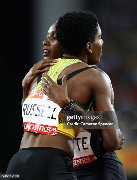 Janieve Russell of Jamaica celebrates winning gold with Ronda Whyte of Jamaica after the Women's 400 metres hurdles final during athletics on day...