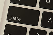 A computer and button for hate