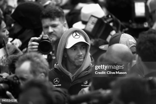 Lewis Hamilton of Great Britain and Mercedes GP is surrounded by fans and photographer during previews ahead of the Formula One Grand Prix of China...