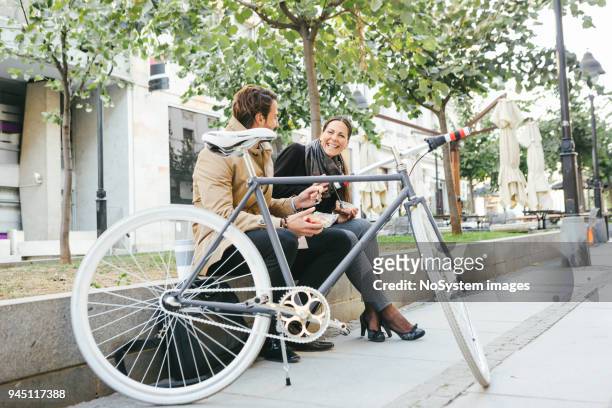 business people having lunch break outdoors - coffee bike stock pictures, royalty-free photos & images