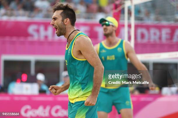 Damien Schumann and Christopher Mchugh of Australia celebrate winning a point in the Beach Volleyball Men's Gold Medal match between Damien Schumann...