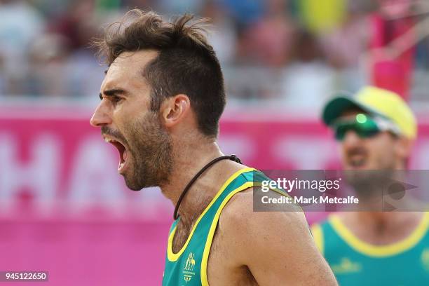 Damien Schumann and Christopher Mchugh of Australia celebrate winning a point in the Beach Volleyball Men's Gold Medal match between Damien Schumann...