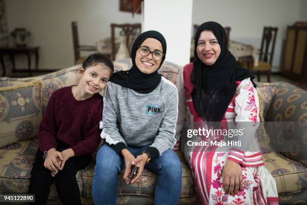 Jordanian National Midfielder Shahnaaz Jebreen her mother Khoula Jebreen and her sister Lojain Jebreen, are posing in the reception room on March 30,...