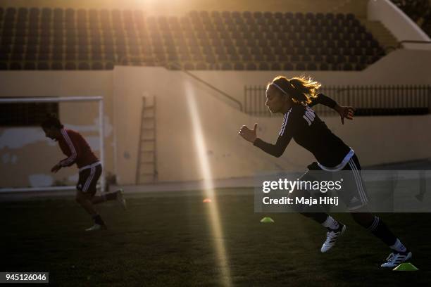 The Captain of the Jordanian Womens National Football Team, Stephanie AlNaber is seen sprinting to warm up prior a test match against Jordans U-15...