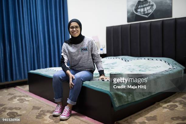 Jordanian National Midfielder Shahnaaz Jebreen is posing in her room in her home on March 30, 2018 in Amman, Jordan, one week before Jordan is...