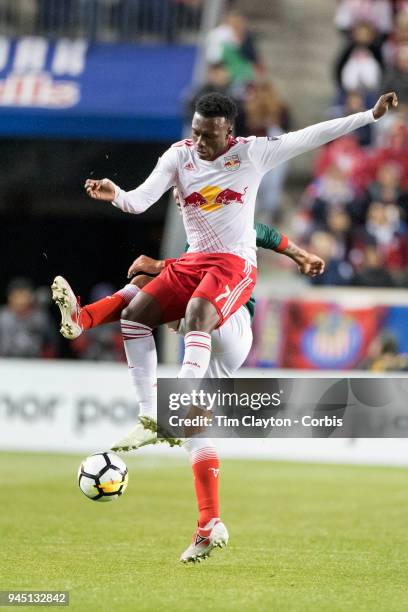 Derrick Etienne of New York Red Bulls challenged by Carlos Salcido of C.D. Guadalajara during the New York Red Bulls Vs C.D. Guadalajara CONCACAF...