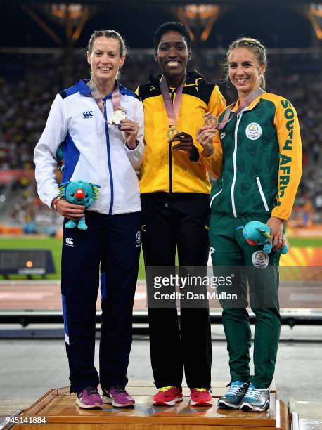 Silver medalist Eilidh Doyle of Scotland, gold medalist Janieve Russell of Jamaica and bronze medalist Wenda Nel of South Africa pose during the...