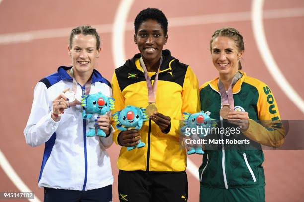 Silver medalist Eilidh Doyle of Scotland, gold medalist Janieve Russell of Jamaica and bronze medalist Wenda Nel of South Africa pose during the...