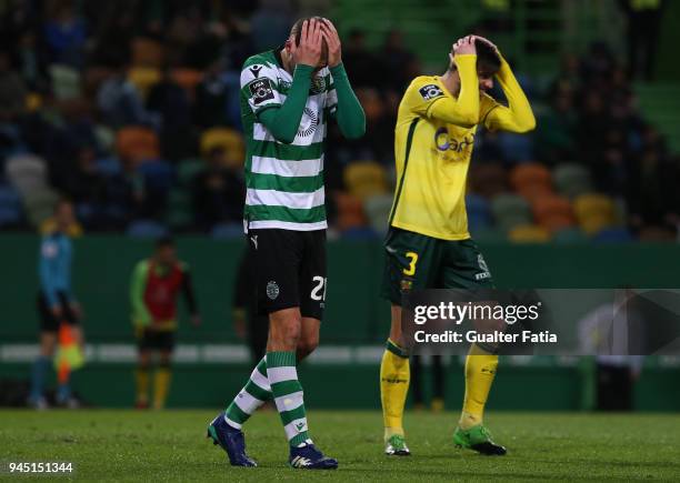 Sporting CP forward Bas Dost from Holland and FC Pacos de Ferreira defender Rui Correia from Portugal react during the Primeira Liga match between...