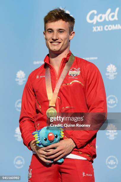 Gold medalist Jack Laugher of England poses during the medal ceremony for the Men's 3m Springboard Diving Final on day eight of the Gold Coast 2018...