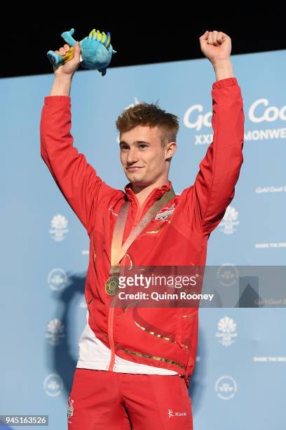 Gold medalist Jack Laugher of England poses during the medal ceremony for the Men's 3m Springboard Diving Final on day eight of the Gold Coast 2018...