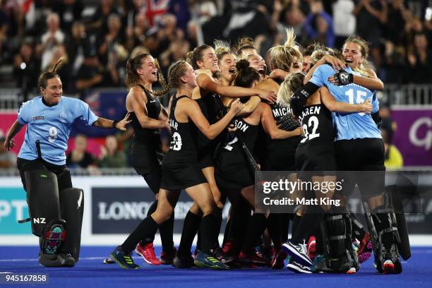 New Zealand celebrates victory after scoring last in the penalty shoot out during Women's Semi Final Hockey match between England and New Zealand on...