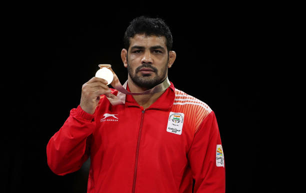 India's Gold medalist Sushil Kumar poses during the medal ceremony for the Men's Freestyle 74 kg during the Wrestling on day eight of the Gold Coast...