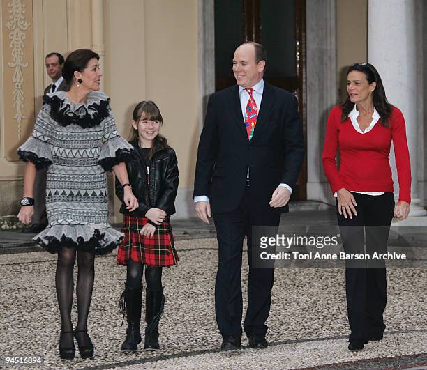 Prince Albert II of Monaco, Princess Caroline of Hanover, Princess Alexandra of Hanover and Princess Stephanie of Monaco prepare to distribute...