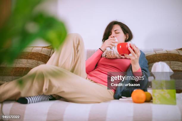 down with the flu - caucasian woman sick in bed coughing stock pictures, royalty-free photos & images