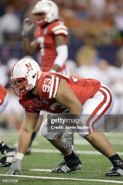 Ndamukong Suh of the Nebraska Cornhuskers gets ready at the line during Big 12 Football Championship game against the Texas Longhorns at Cowboys...