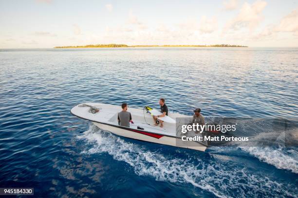 heading out to catch some waves - duck dive stock pictures, royalty-free photos & images