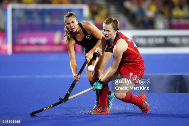 Rose Keddell of New Zealand is challenged by Elena Rayer of England during Women's Semi Final Hockey match between England and New Zealand on day...