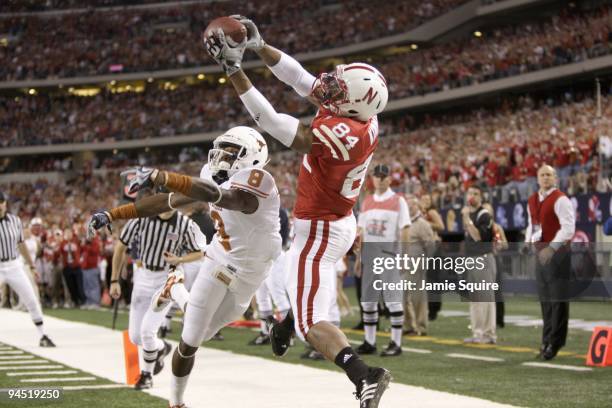 Brandon Kinnie of the Nebraska Cornhuskers leaps for the catch against Chykie Brown of the Texas Longhorns during Big 12 Football Championship game...