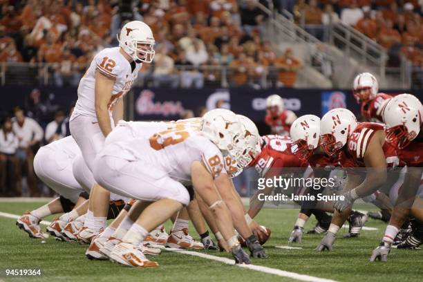 Colt McCoy of the Texas Longhorns calls the play at the line of scrimmage during the Big 12 Football Championship game against the Nebraska...