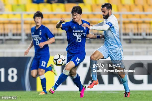 Koo Ja-Ryong of Suwon Samsung Bluewings fights for the ball with Alex Brosque of Sydney FC during the AFC Champions League 2018 Group H match between...