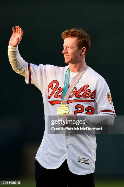 Paralympic men"u2019s sled hockey team member Noah Grove throws out the ceremonial first pitch before a game between the Toronto Blue Jays and...