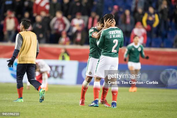 Carlos Salcido of C.D. Guadalajara and Oswaldo Alanis of C.D. Guadalajara celebrate with team mates after the final whistle during the New York Red...