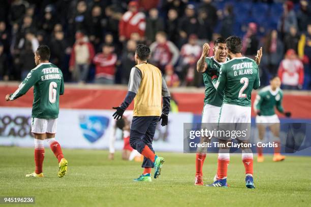 Carlos Salcido of C.D. Guadalajara and Oswaldo Alanis of C.D. Guadalajara celebrate with team mates after the final whistle during the New York Red...