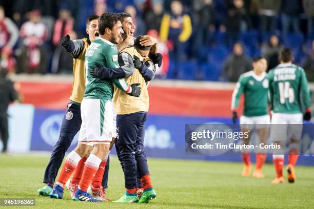 Carlos Salcido of C.D. Guadalajara and Oswaldo Alanis of C.D. Guadalajara celebrate with team mates after the final whistle during the New York Red...