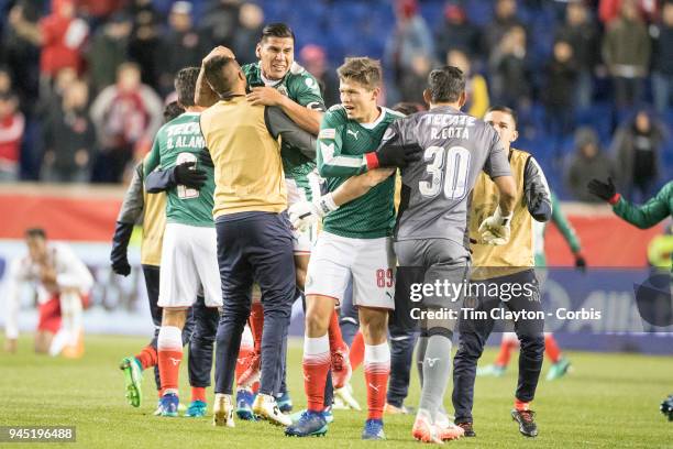 Carlos Salcido of C.D. Guadalajara and Oswaldo Alanis of C.D. Guadalajara celebrate with team mates after the final whistle during the New York Red...