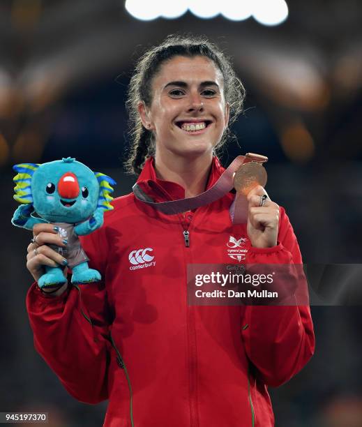 Bronze medalist Olivia Breen of Wales poses during the medal ceremony for the Womens T38 100 metresduring athletics on day eight of the Gold Coast...