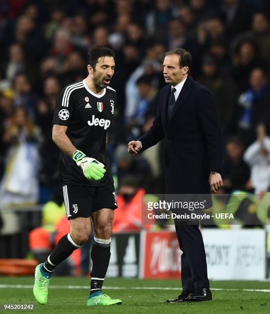 Gianluigi Buffon of Juventus walks past his manager Massimiliano Allegri after been sent off during the UEFA Champions League Quarter Final Second...