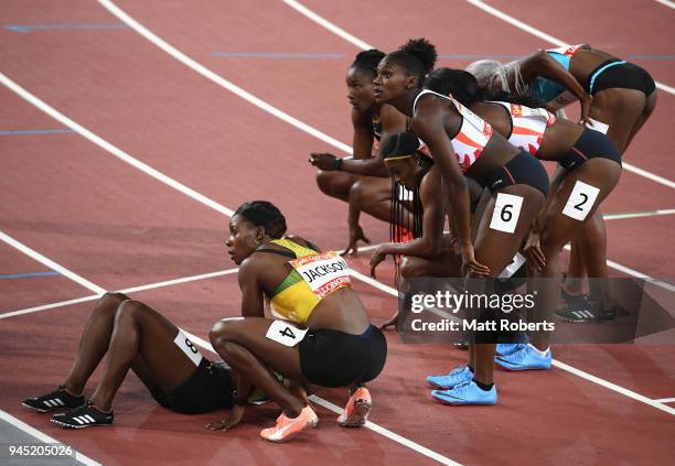 Dina Asher-Smith of England and Shericka Jackson of Jamaica look at the scoreboard after the Women's 200 metres final during athletics on day eight...