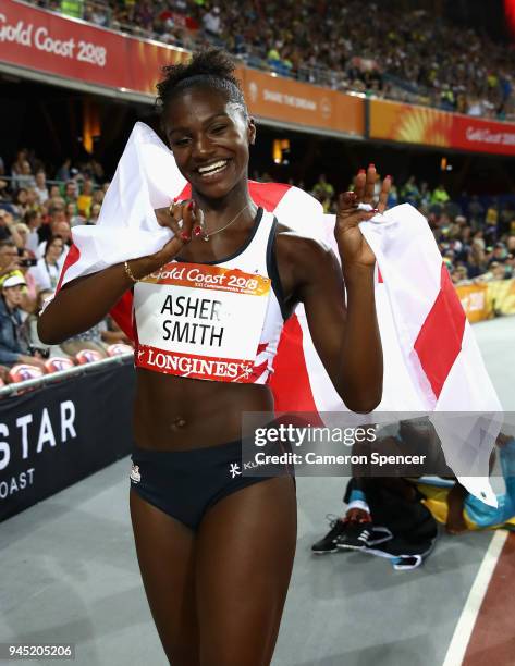 Dina Asher-Smith of England celebrates winning bronze in the Women's 200 metres final during athletics on day eight of the Gold Coast 2018...