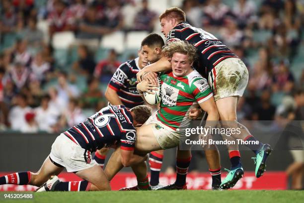 George Burgess of the Rabbitohs is tackled by Roosters defence during the round six NRL match between the Sydney Roosters and the South Sydney...