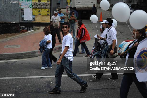 People take part in the 'World March for Peace and Non-Violence' in Bogota on December 16, 2009. The World March began in New Zealand on October 2,...
