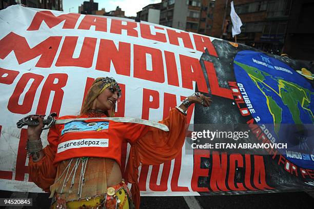 Woman takes part in the 'World March for Peace and Non-Violence' in Bogota on December 16, 2009. The World March began in New Zealand on October 2,...