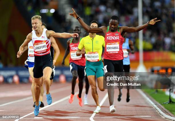 Wycliffe Kinyamal of Kenya crosses the line to win gold ahead of Kyle Langford of England in the Men's 800 metres final during athletics on day eight...