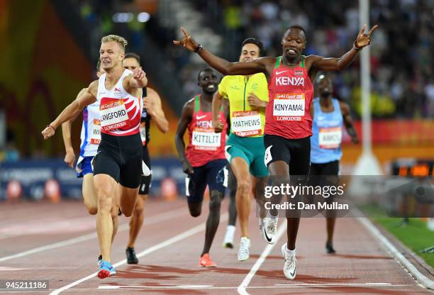 Wycliffe Kinyamal of Kenya crosses the line to win gold ahead of Kyle Langford of England in the Men's 800 metres final during athletics on day eight...