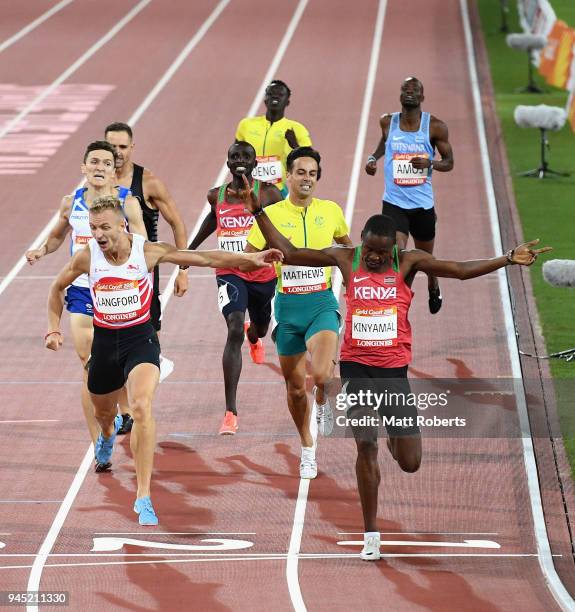 Wycliffe Kinyamal of Kenya crosses the line to win gold ahead of Kyle Langford of England in the Men's 800 metres final during athletics on day eight...