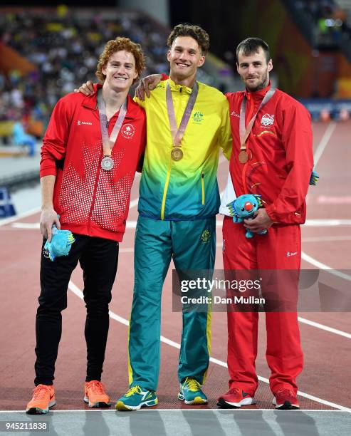 Silver medalist Shawnacy Barber of Canada, gold medalist Kurtis Marschall of Australia and bronze medalist Luke Cutts of England pose during the...