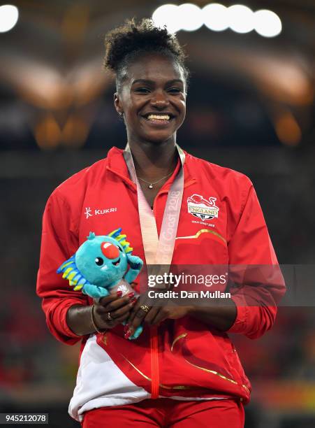 Bronze medalist Dina Asher-Smith of England looks on during the medal ceremony for the Womens 200 metresduring athletics on day eight of the Gold...