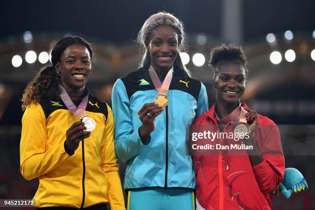 Silver medalist Shericka Jackson of Jamaica, gold medalist Shaunae Miller-Uibo of the Bahamas and bronze medalist Dina Asher-Smith of England pose...