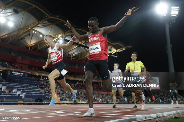 Englands Kyle Langford and Kenyas Wycliffe Kinyamal compete in the athletics men's 800m final during the 2018 Gold Coast Commonwealth Games at the...