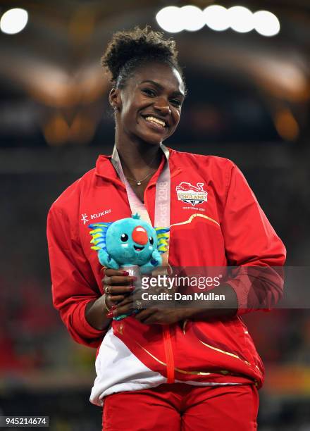 Bronze medalist Dina Asher-Smith of England looks on during the medal ceremony for the Womens 200 metresduring athletics on day eight of the Gold...
