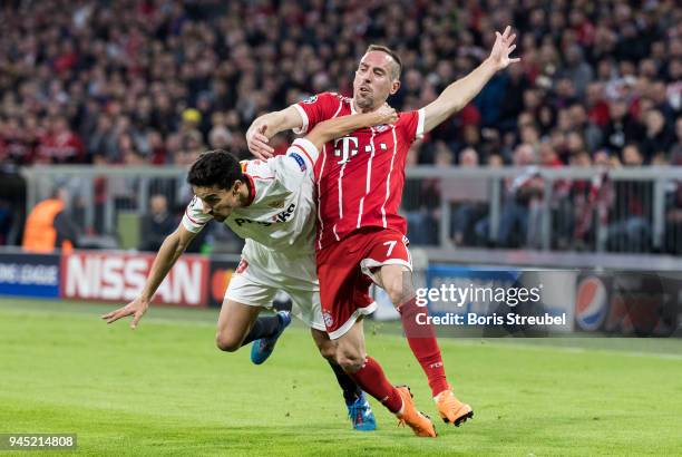 Franck Ribery of FC Bayern Muenchen is challenged by Jesus Navas of FC Sevilla during the UEFA Champions League Quarter Final second leg match...