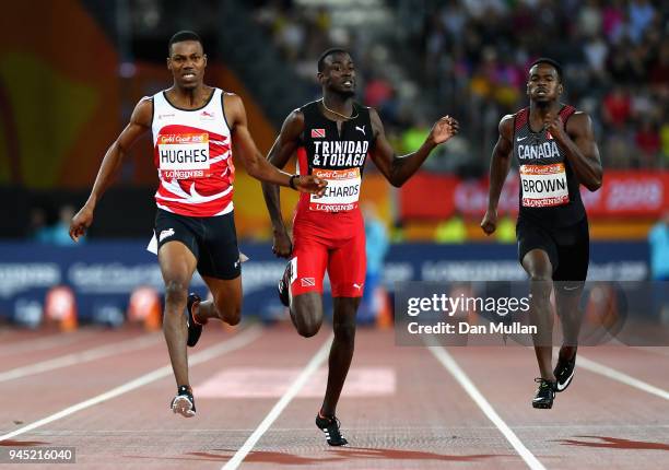 Zharnel Hughes of England, Jereem Richards of Trinidad and Tobago and Aaron Brown of Canada compete in the Men's 200 metres final during athletics on...