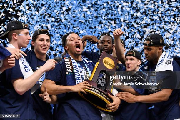 Jalen Brunson of the Villanova Wildcats celebrates with the trophy after the 2018 NCAA Photos via Getty Images Men's Final Four National Championship...